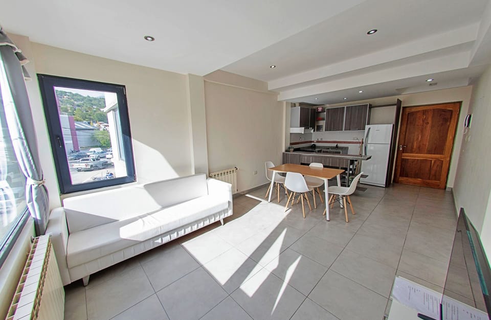Family Apartment | Living area | 50-inch Smart TV with cable channels
