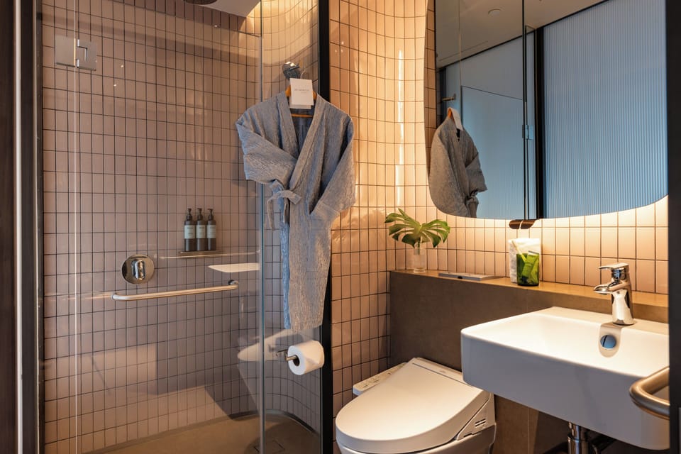 Shower, rainfall showerhead, designer toiletries, hair dryer