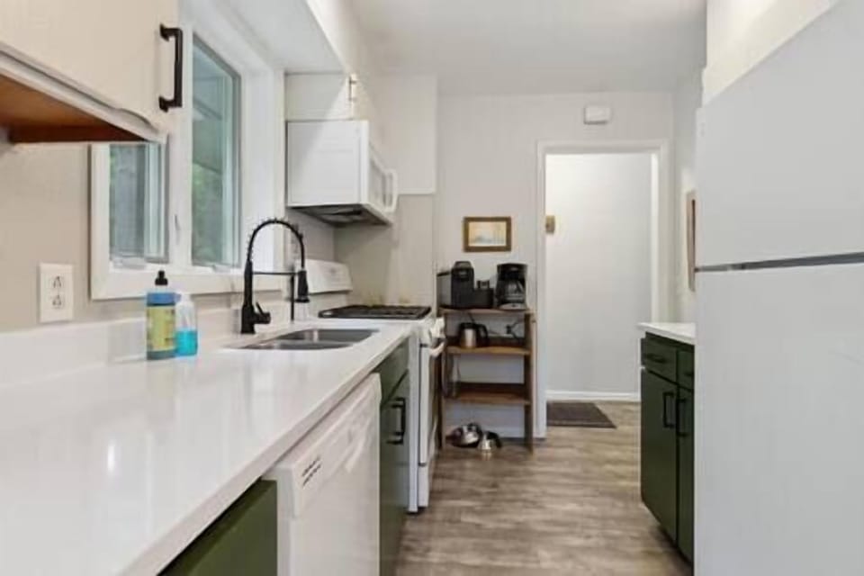 Updated kitchen with quartz counters and all necessary utensils