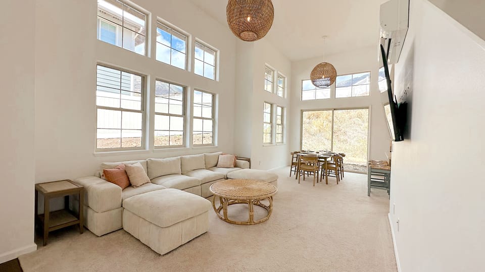 Clean and comfortable living space! The living room leads into the kitchen.