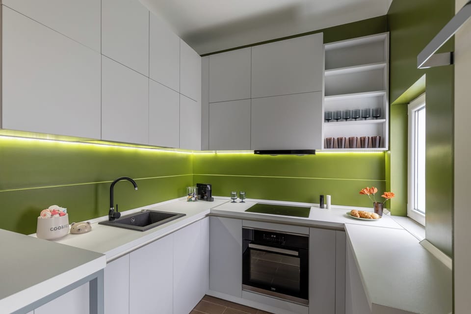 Deluxe Apartment | Private kitchen | Espresso maker, coffee/tea maker, full-size fridge, microwave