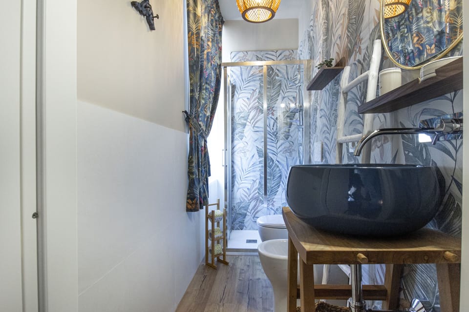 Triple Room | Bathroom | Shower, rainfall showerhead, hair dryer, bathrobes