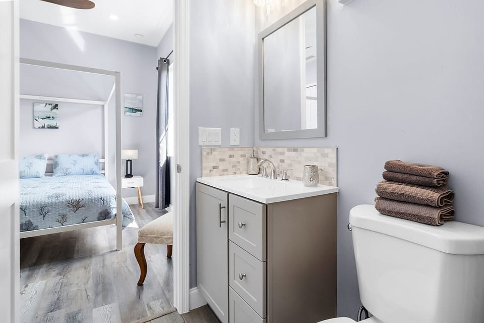 Bedroom 1 with a queen bed and en-suite bathroom