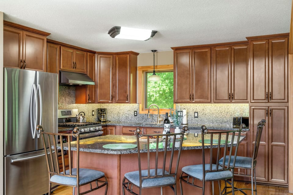 Well stocked state-of-the-art kitchen with all the stainless steel appliances.