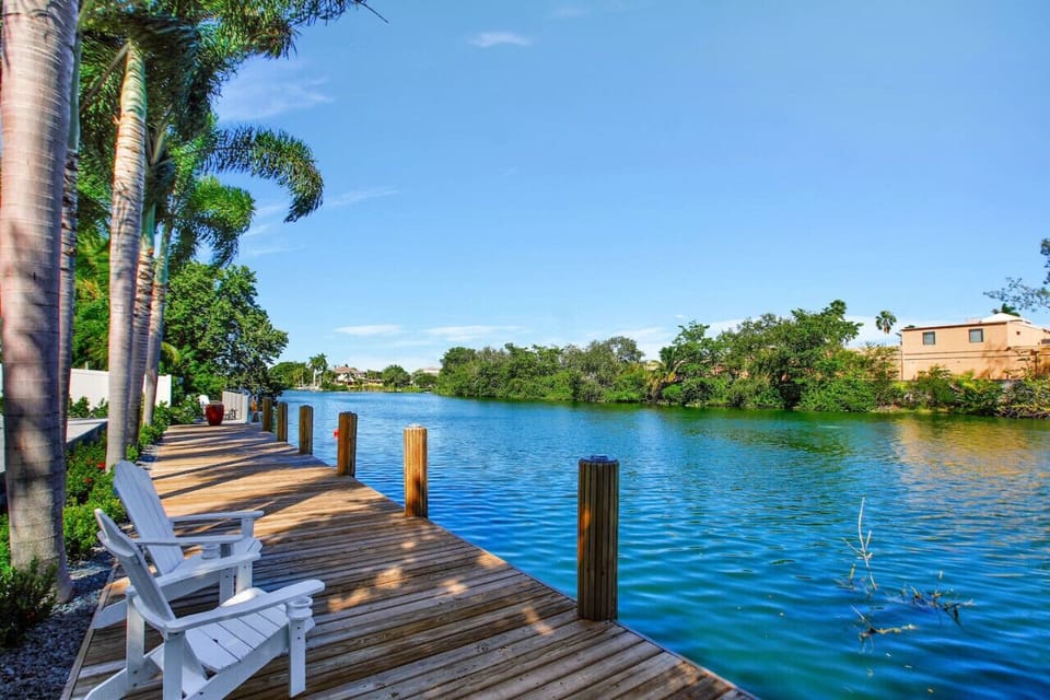 Tranquility by the Lake: Let the gentle sway of the water soothe your soul as you unwind in Adirondack chairs on the dock.