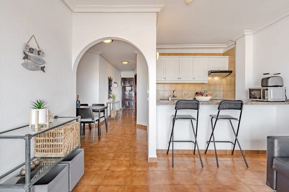 Living Room with Bar & Dining Area, TV, Ceiling Fan & Views