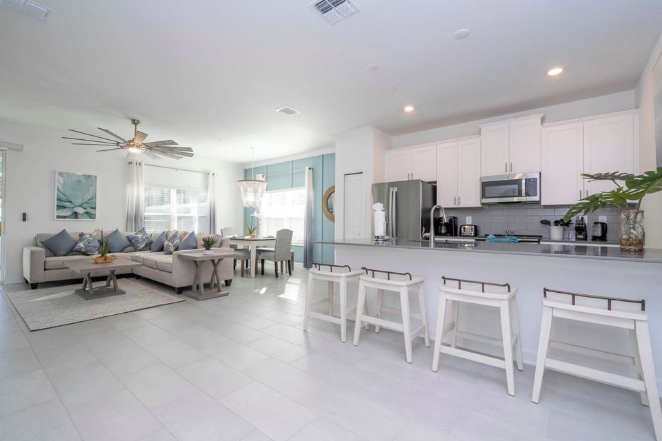 Cook your favorite meals with ease in a sleek kitchen featuring stainless-steel appliances, granite countertops, and all cooking essentials.