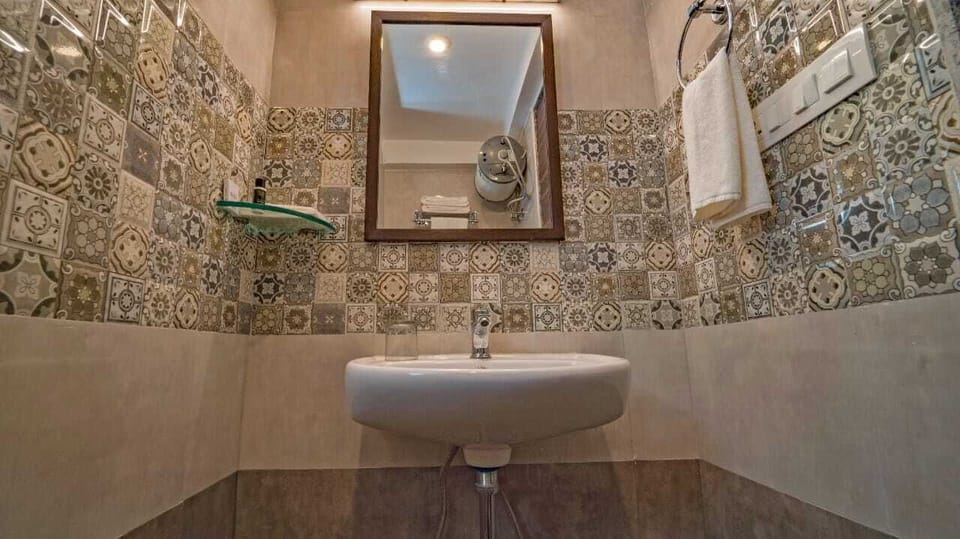 Shower, rainfall showerhead, slippers, towels