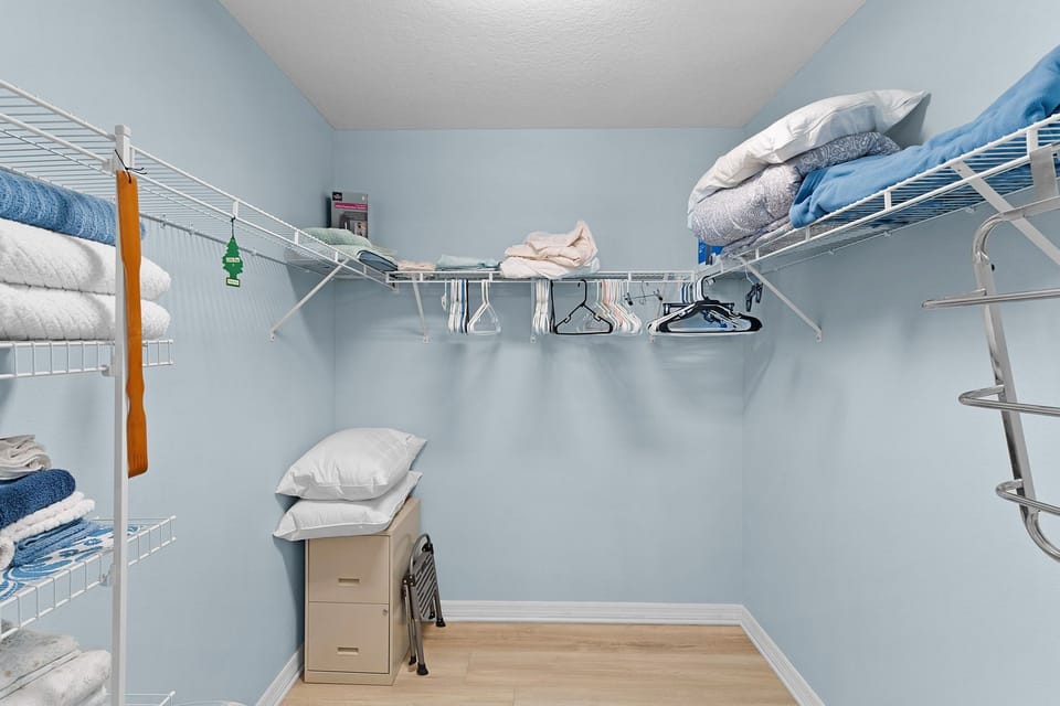 A roomy walk-in closet with ample shelving and hanging space keeps your wardrobe organized and accessible throughout your stay.