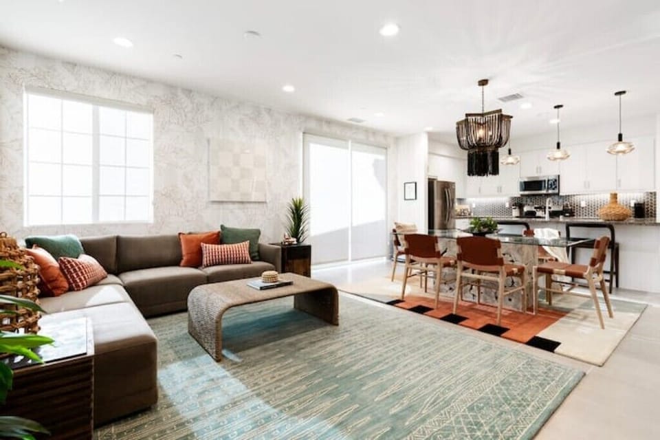 This area has sliding glass doors that lead to the patio seating area with BBQ.