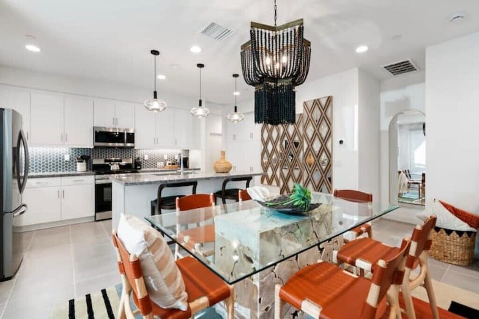 The dining area seats six, with two bar stools on the kitchen island.