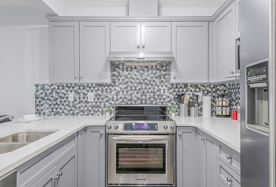 Our kitchen bar area provides the perfect spot for a quick bite or a casual cocktail.