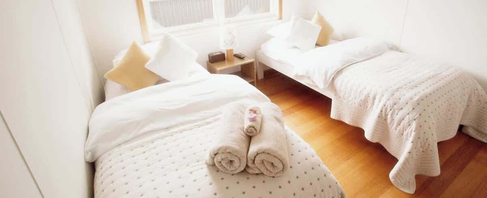 Thick white towels and comfortable single beds