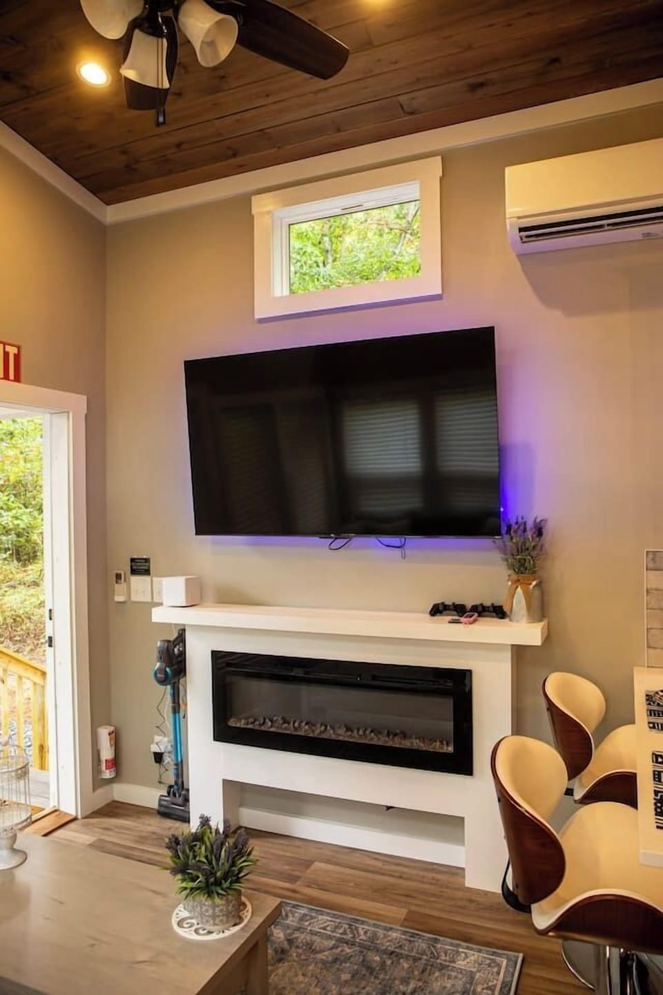 Large flat screen tv with fireplace.