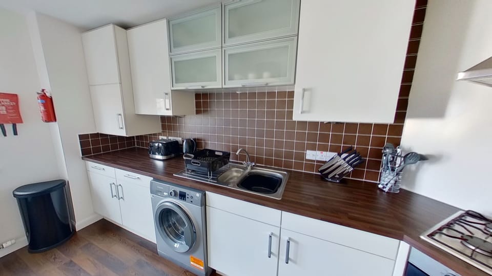 Apartment, 4 Bedrooms | Private kitchen | Fridge, microwave, coffee/tea maker, electric kettle