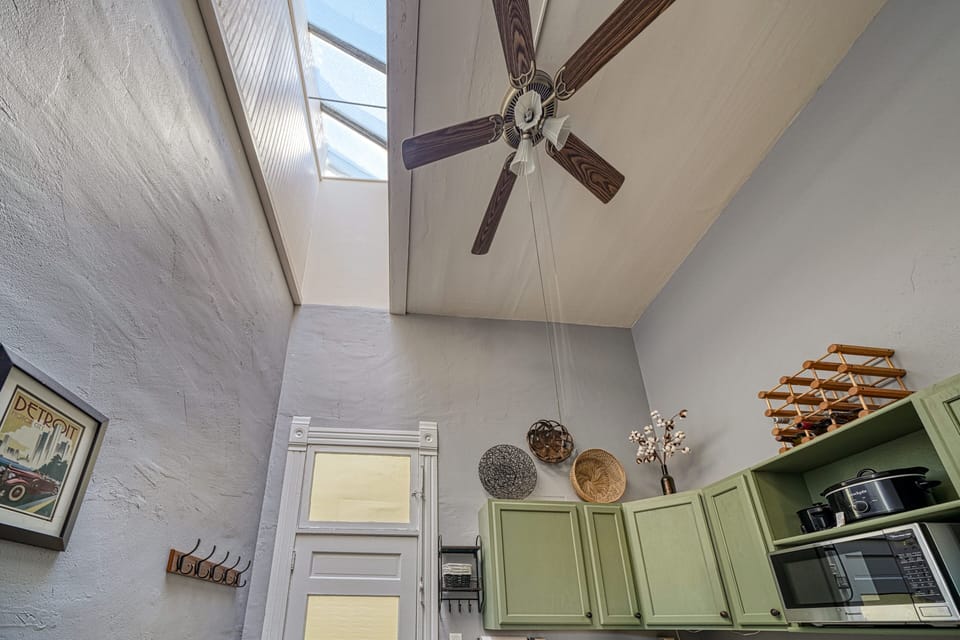 This bright sunny apartment has tall ceilings with skylights
