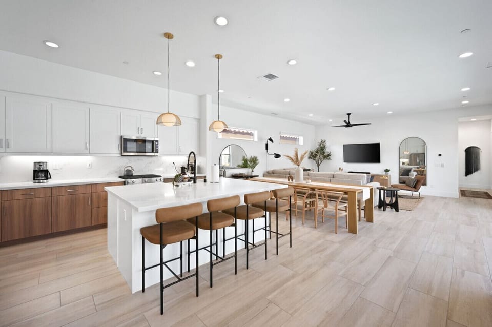 Sleek kitchen w/ extended island seating, ideal for cooking & gathering