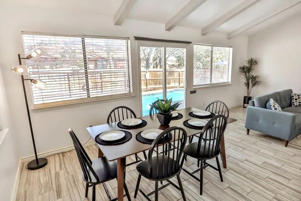 Dining table to enjoy eating while looking out at the pool.