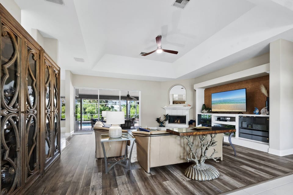 Furnished living room with a big screen TV