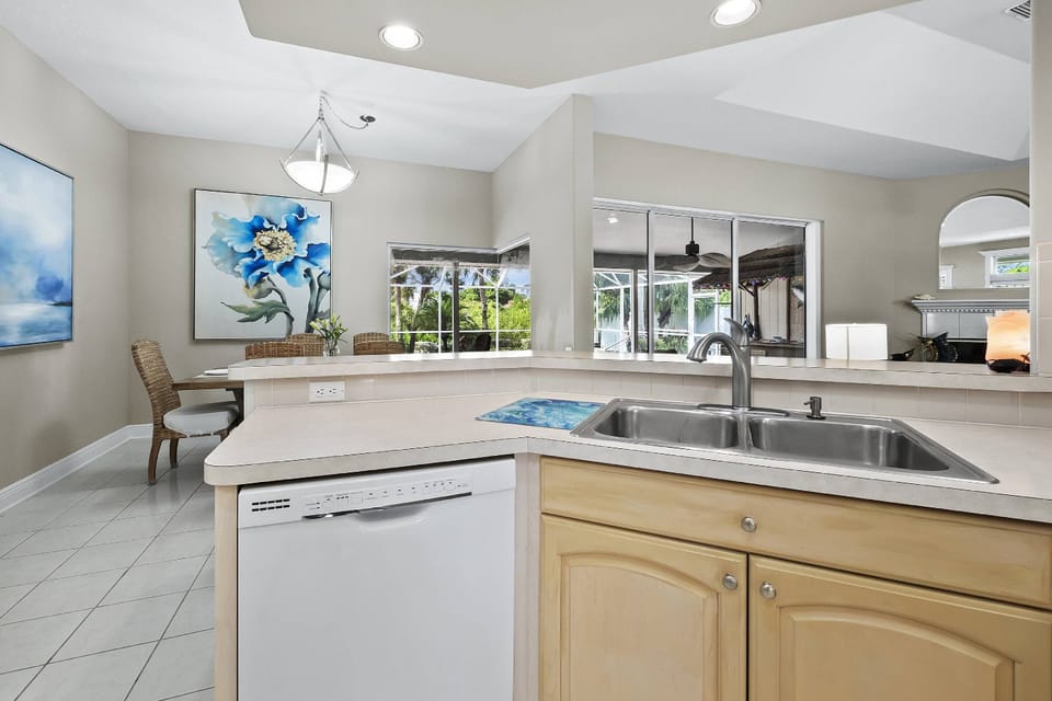 Big, open kitchen with both formal and casual dining areas off each end