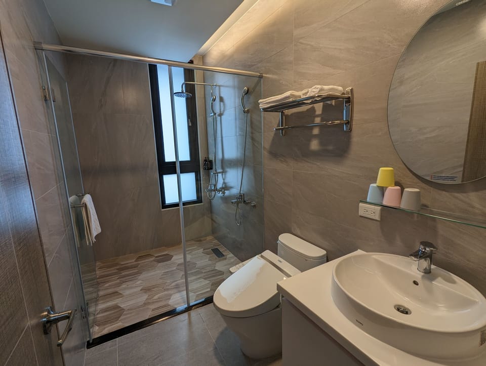 Quadruple Room | Bathroom | Shower, hydromassage showerhead, hair dryer, slippers