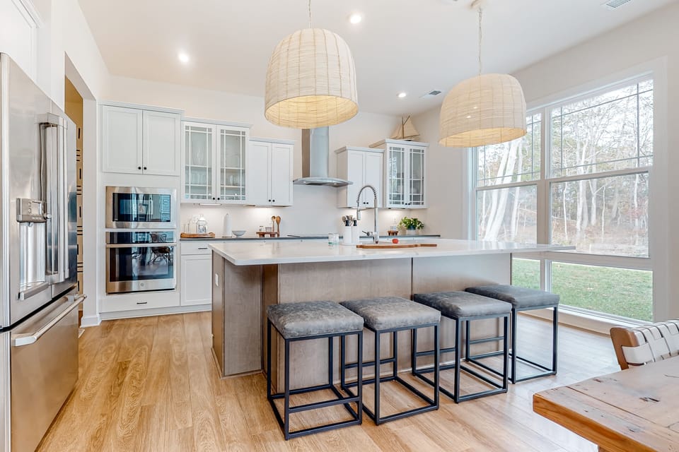 Chef's kitchen with large island and double ovens