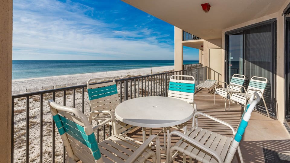 Soak in the serene views of the tranquil water and shoreline from the beachfront balcony
