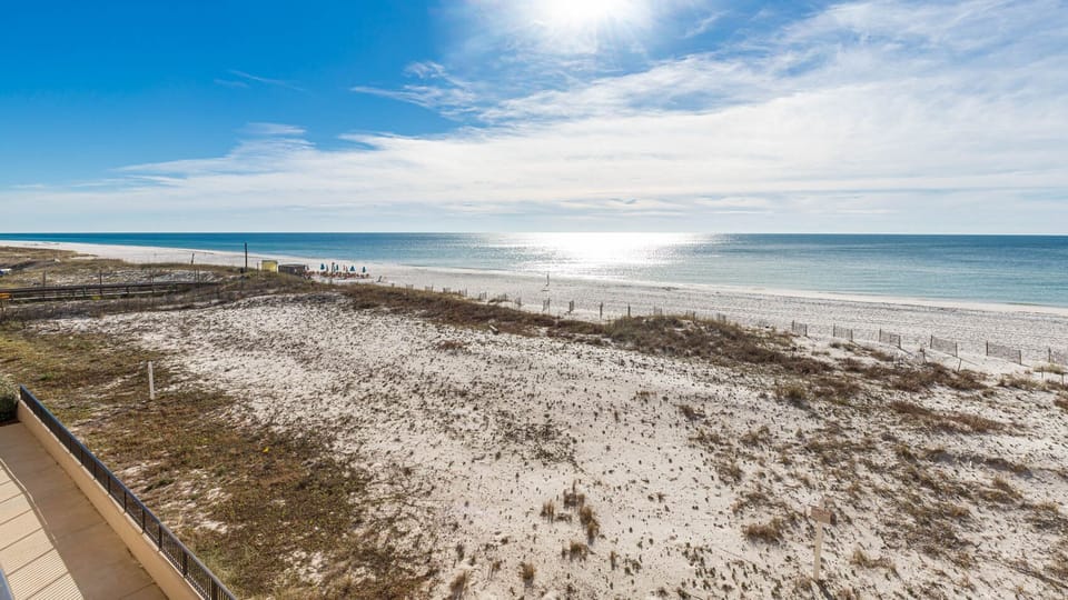 Enjoy breathtaking views of the tranquil water and shoreline from your spacious outdoor area, perfect for relaxation