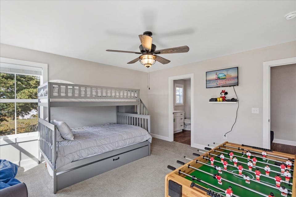 Flat Screen TV and Foosball - there is also Games, Legos, and a Mini Chess Table!
