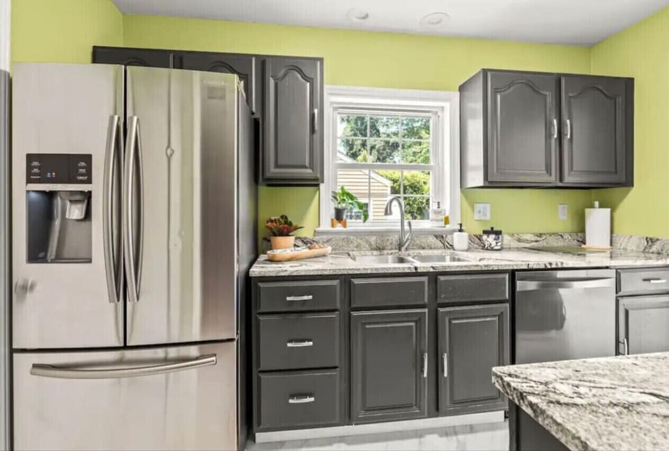 Galley kitchen with pots, pans, utensils, dishware, basic spices, toaster, and Keurig