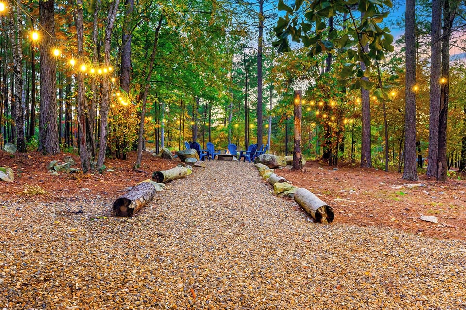 Outdoor Firepit Area: Gather 'round the firepit beneath twinkling lights in nature's embrace!