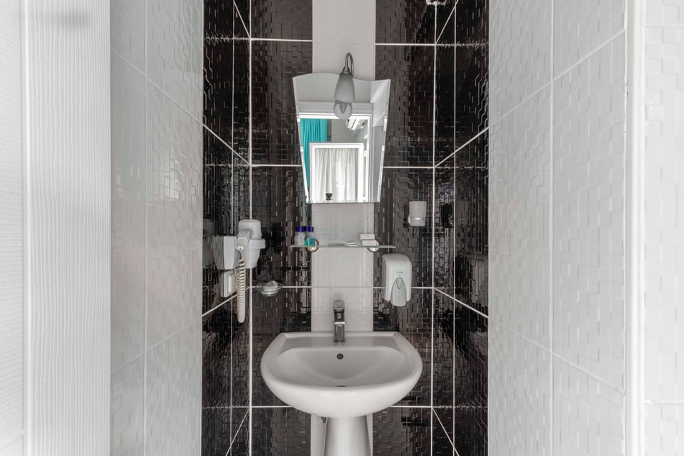 Shower, hair dryer, slippers, towels