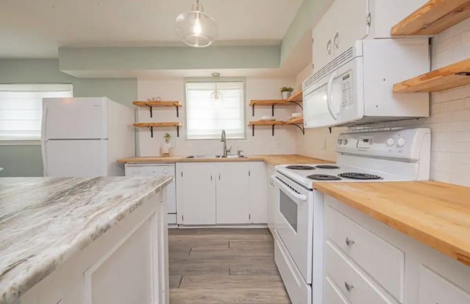 Spacious living, dining & kitchen area w a beautiful island w an open concept