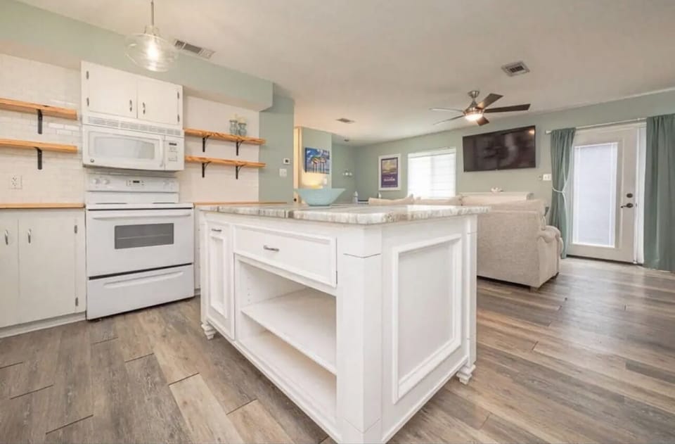 Nice kitchen with big island that opens to living area and dining area