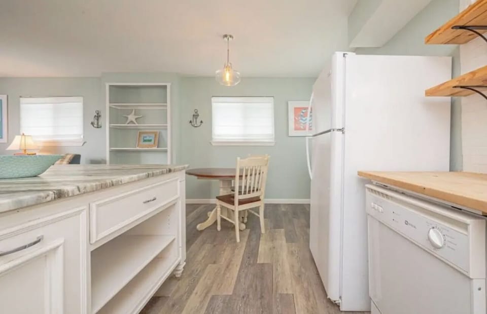 Nice kitchen with big island that opens to living area