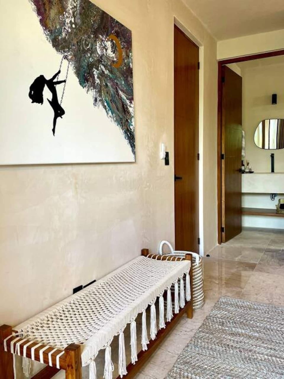 Custom artwork and direct access to the hall bathroom from the second main floor bedroom