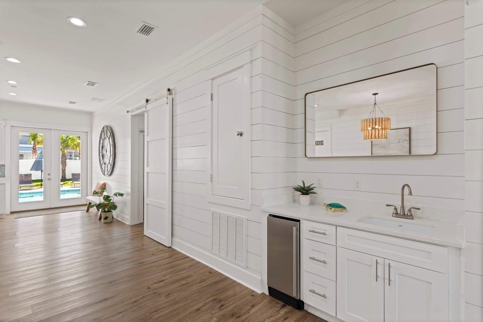 Sleek kitchen w/ white cabinetry, clean counters, and a fresh modern look.