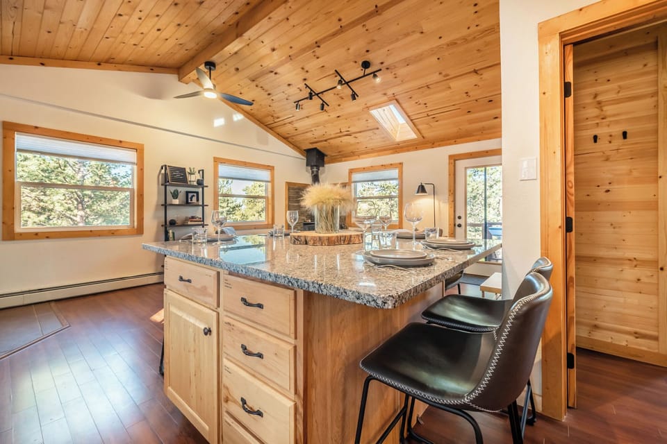 The large and spacious granite counter top doubles as an open-concept dining area. The table seats six and has plenty of space for that Thanksgiving Turkey and all the sides! During the colder months enjoy the heat from the fire place while you dine.