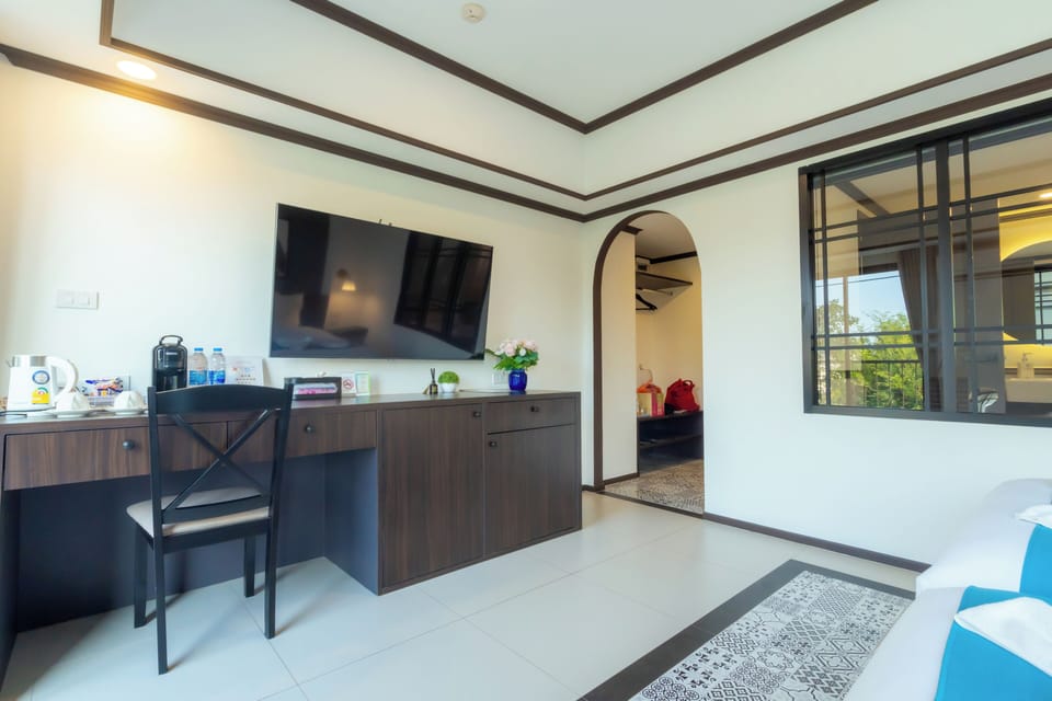 Deluxe Twin Room | Living area | 55-inch Smart TV with digital channels