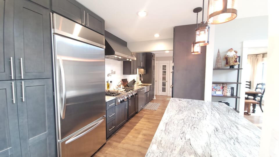 Chef's kitchen, with 6 burner gas range, conv oven, and tons of counter space.