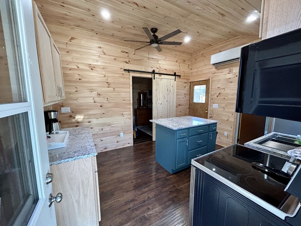 Full kitchen, stainless steel appliances and quartz countertops.