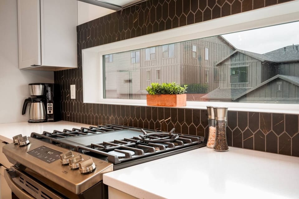 Cook your favorite meals in a kitchen bathed in natural light that enhance the culinary experience.
