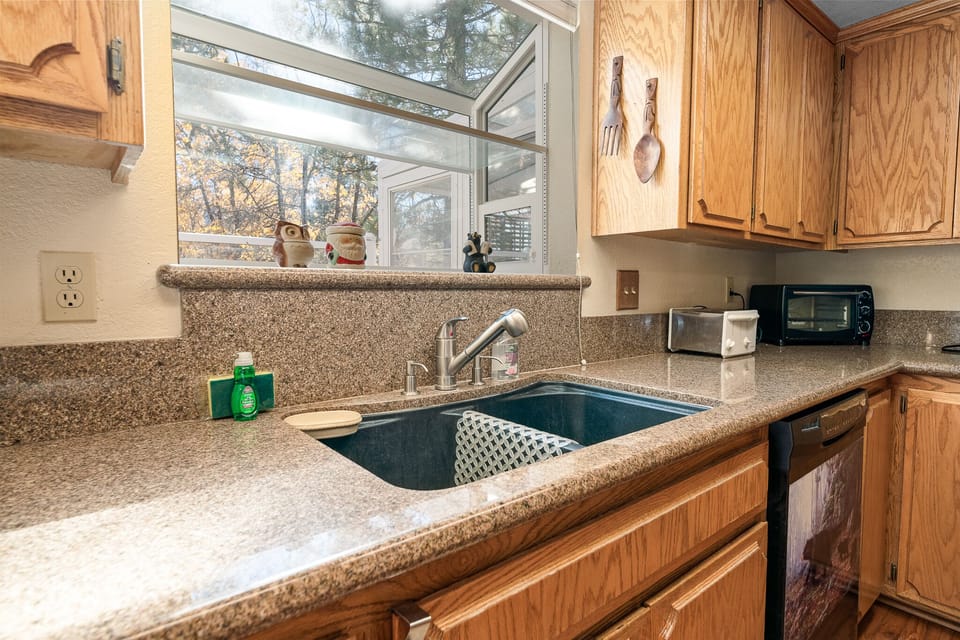 toaster oven, toaster and dishwasher in kitchen