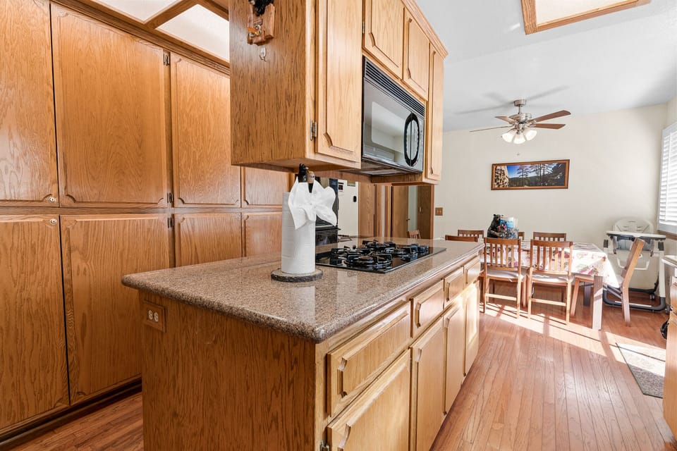 kitchen has plenty of counter space surrounding the stove top for easy prepping and cooking