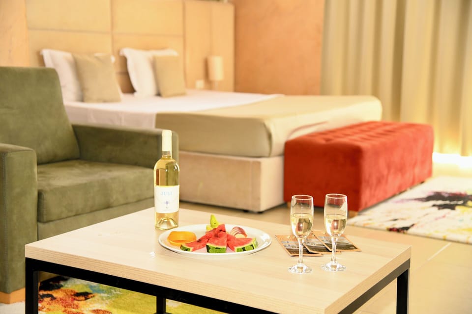 Suite, 1 King Bed, Beach View | Minibar, desk, blackout drapes, iron/ironing board