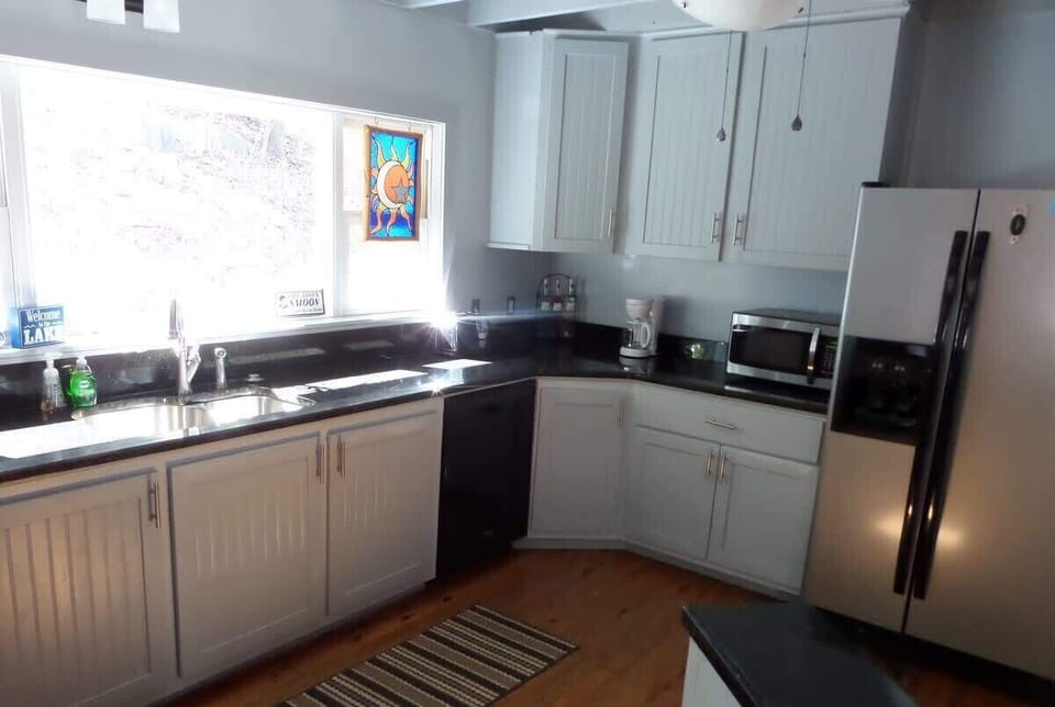 Full kitchen with Coffee Maker, Microwave, Fridge, Stove/Oven, and lots of counter space.