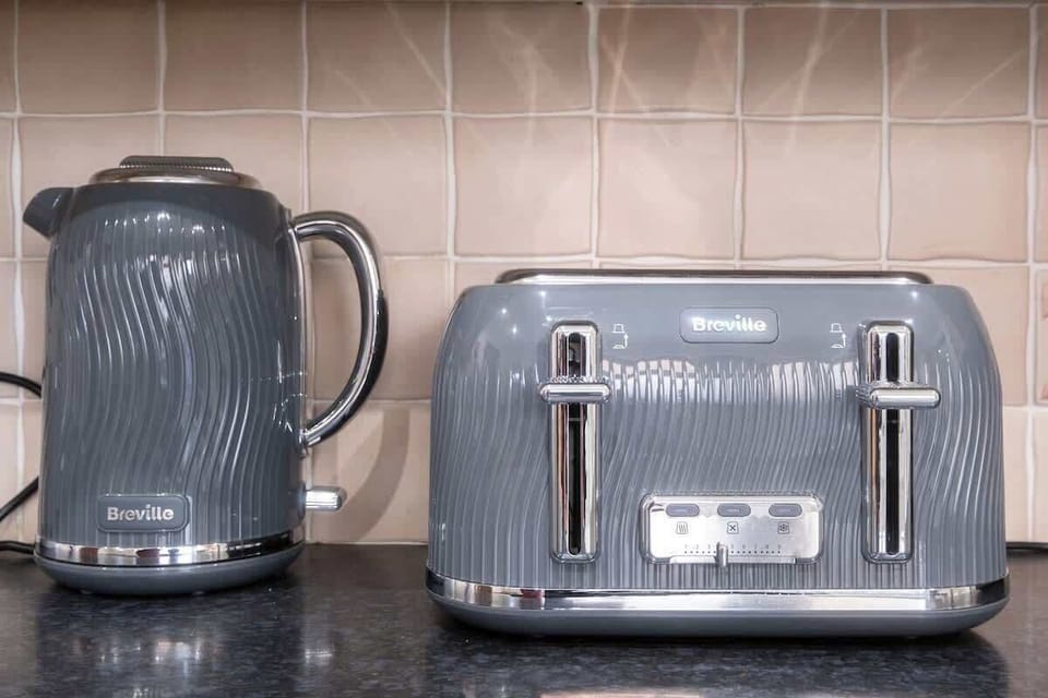 Cook, clean, and feel at home – the kitchen comes fully stocked with all the essentials, including a washing machine