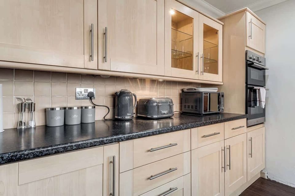 Cook, clean, and feel at home – the kitchen comes fully stocked with all the essentials, including a washing machine