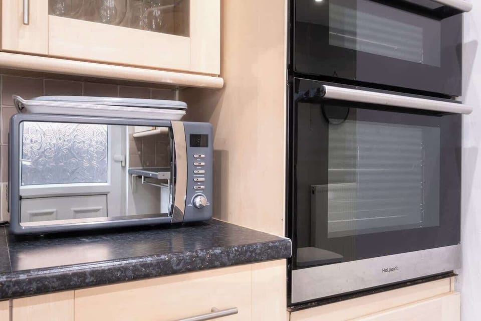 Cook, clean, and feel at home – the kitchen comes fully stocked with all the essentials, including a washing machine