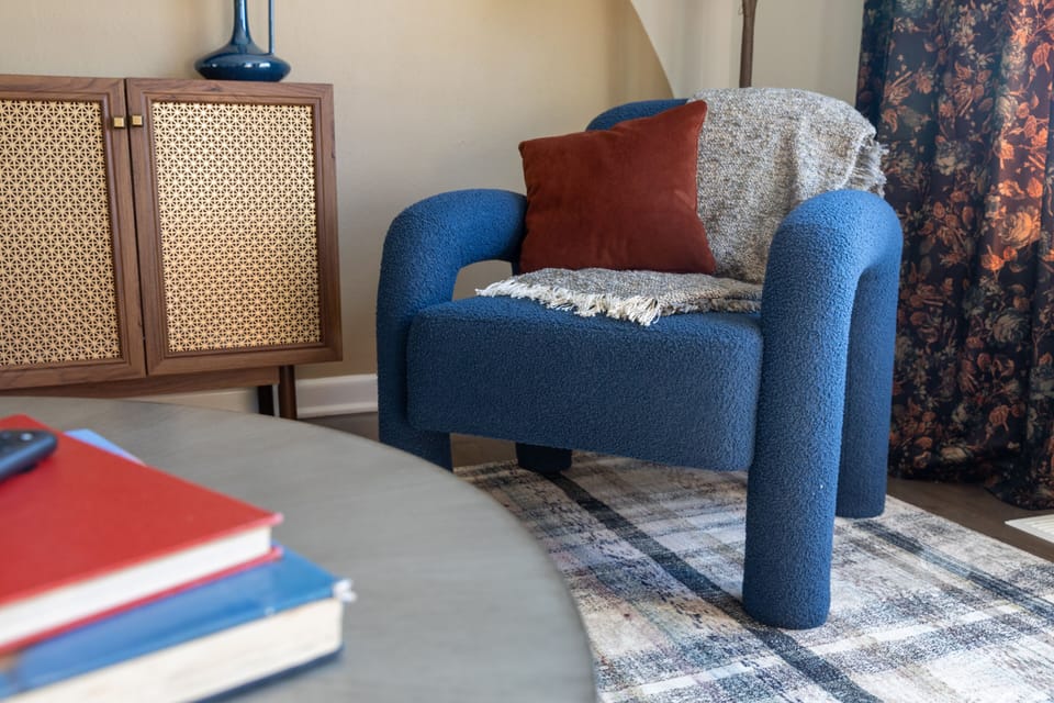 Plush and eclectic lounge chair in the living area